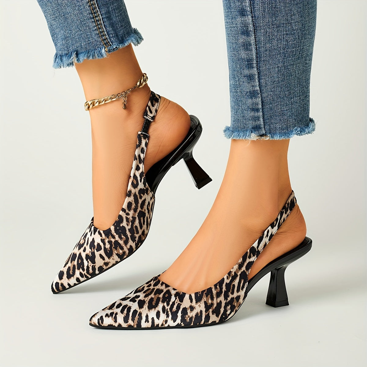 Leopard print stiletto sandals with pointed toe, slip-on style, and high heels in black and brown animal pattern. Comfortable for fall fashion.