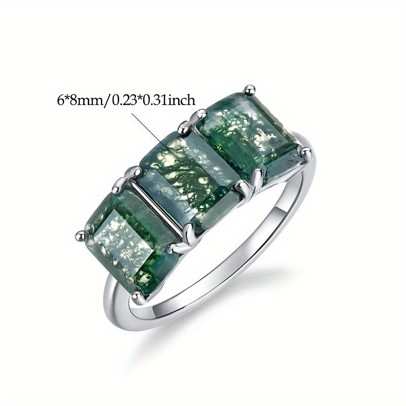 Handcrafted with elegance, the ALLNOEL Simple 925 Sterling Silver Ring features a natural Moss Agate gemstone in a square 6*8mm cut, making it the perfect June birthstone for daily wear or special occasions. This piece exudes sophistication and charm