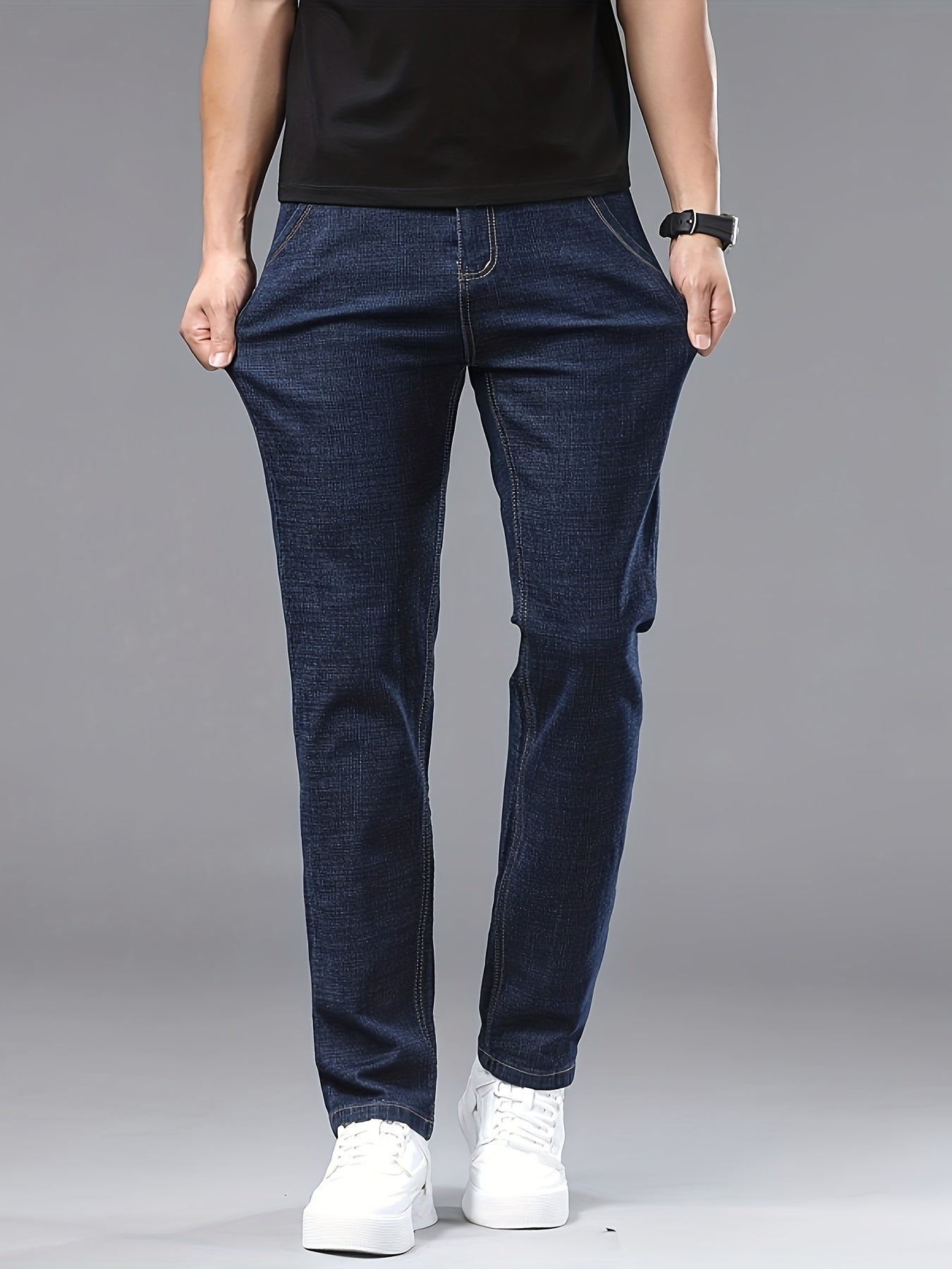 Men's slim-fit jeans made of 61.6% cotton, 36.9% polyester, and 1.5% spandex with all-season stretch denim. Raw wash in a solid color, regular fit for casual weekends. 200gsm woven fabric.