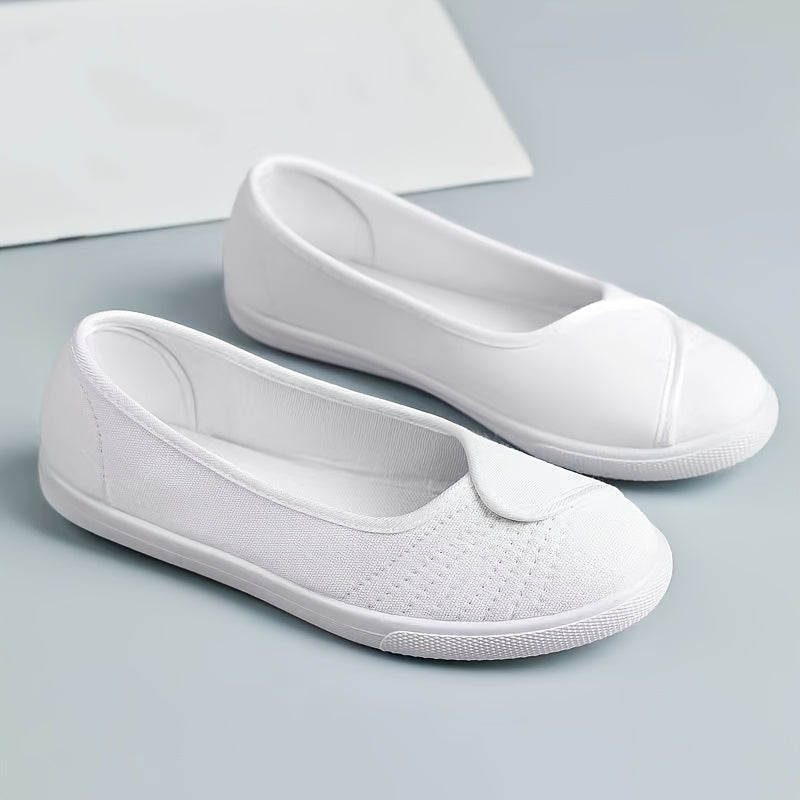 Women's white slip-on sneakers with breathable fabric upper, rubber sole, round toe, and sporty design.