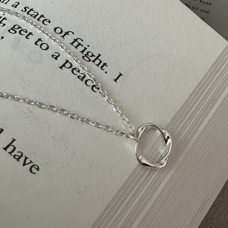 This stylish Sterling Silver Mobius Strip Pendant Necklace is perfect for both daily wear and special occasions. A versatile piece of women's jewelry, this necklace adds a touch of sophistication to any outfit.