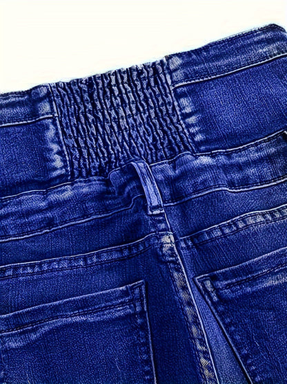 High-waisted skinny jeans with button detail for plus size women, in blue denim.