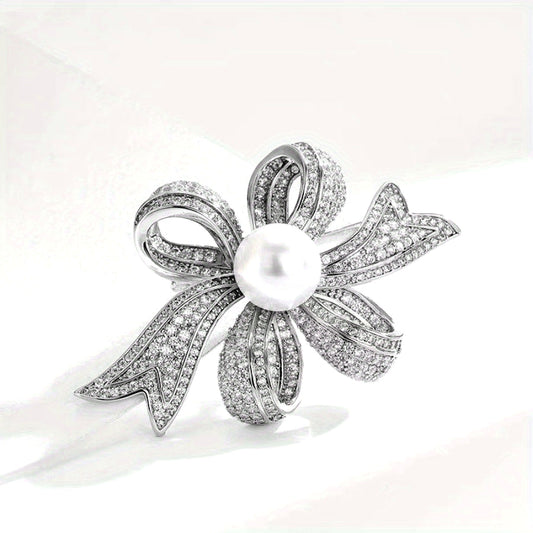 Elegant pearl brooch with a non-specific flower design, perfect for both women and men to wear as a fashion accessory. This silky scarf buckle exudes a luxurious and elegant temperament, making it a great holiday gift for anyone looking to add a touch of