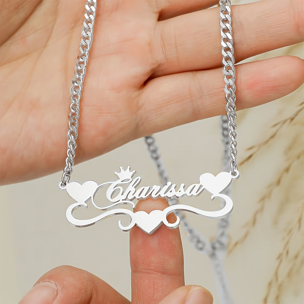 A single elegant custom 4MM Cuban link chain necklace with personalized name pendant, featuring a stainless steel heart ribbon plaque. This fashion crown jewelry for women is a versatile daily accessory suitable for all-season wear.