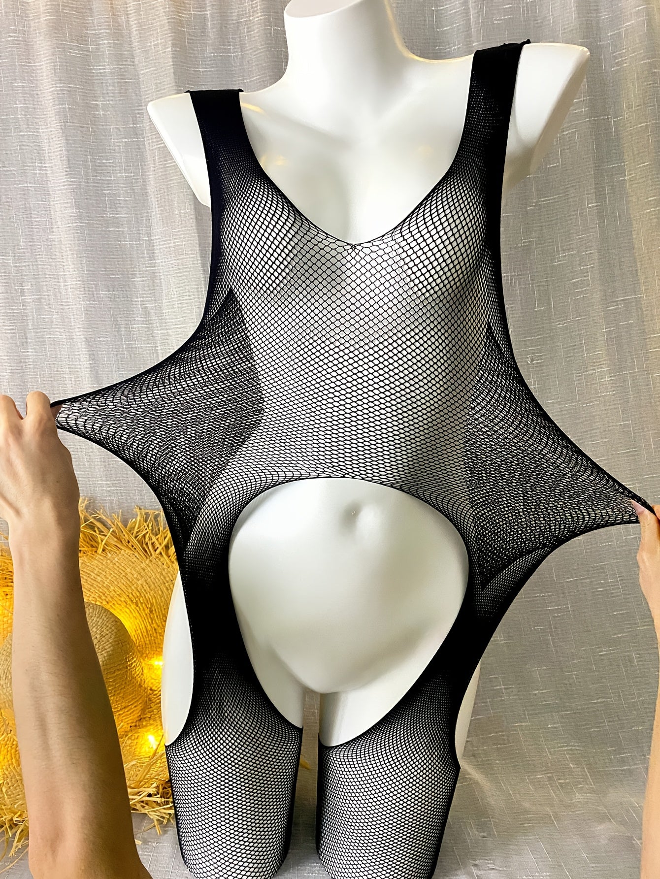 Women's see-through bodysuit with open crotch, perfect for beachwear and swimwear.