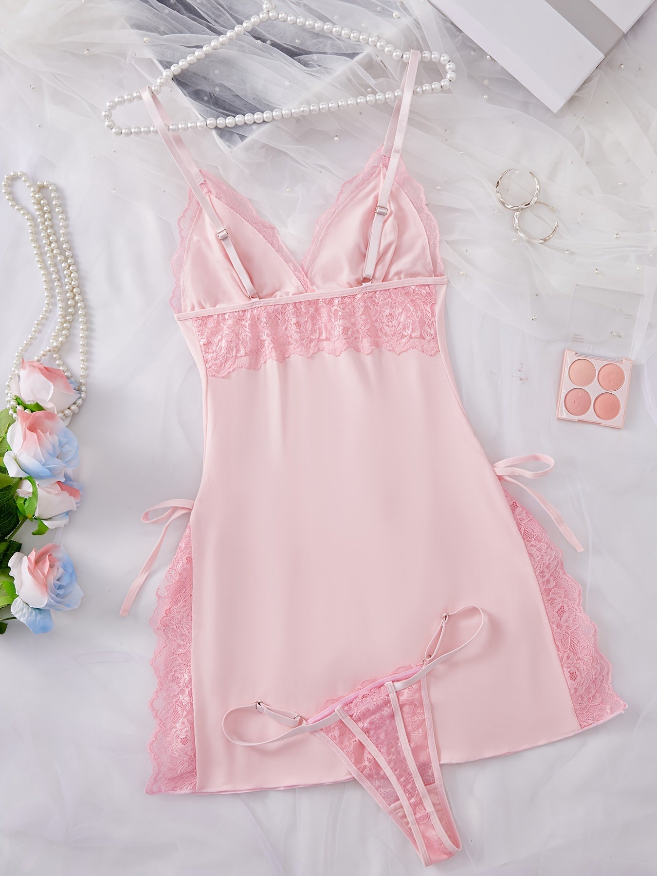 Women's sexy nightdress and panty set with V-neck, thin shoulder straps, and fashionable charm design.