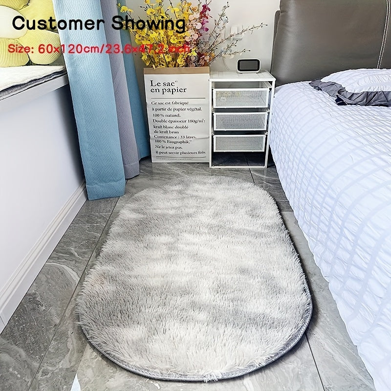 Soft and fluffy oval area rug, designed for use in living rooms, bedrooms, game rooms, and dormitories. Made of non-slip, washable polyester material. Machine-made shaggy rug perfect for adding a cozy touch to your space. Ideal for use as a bedside