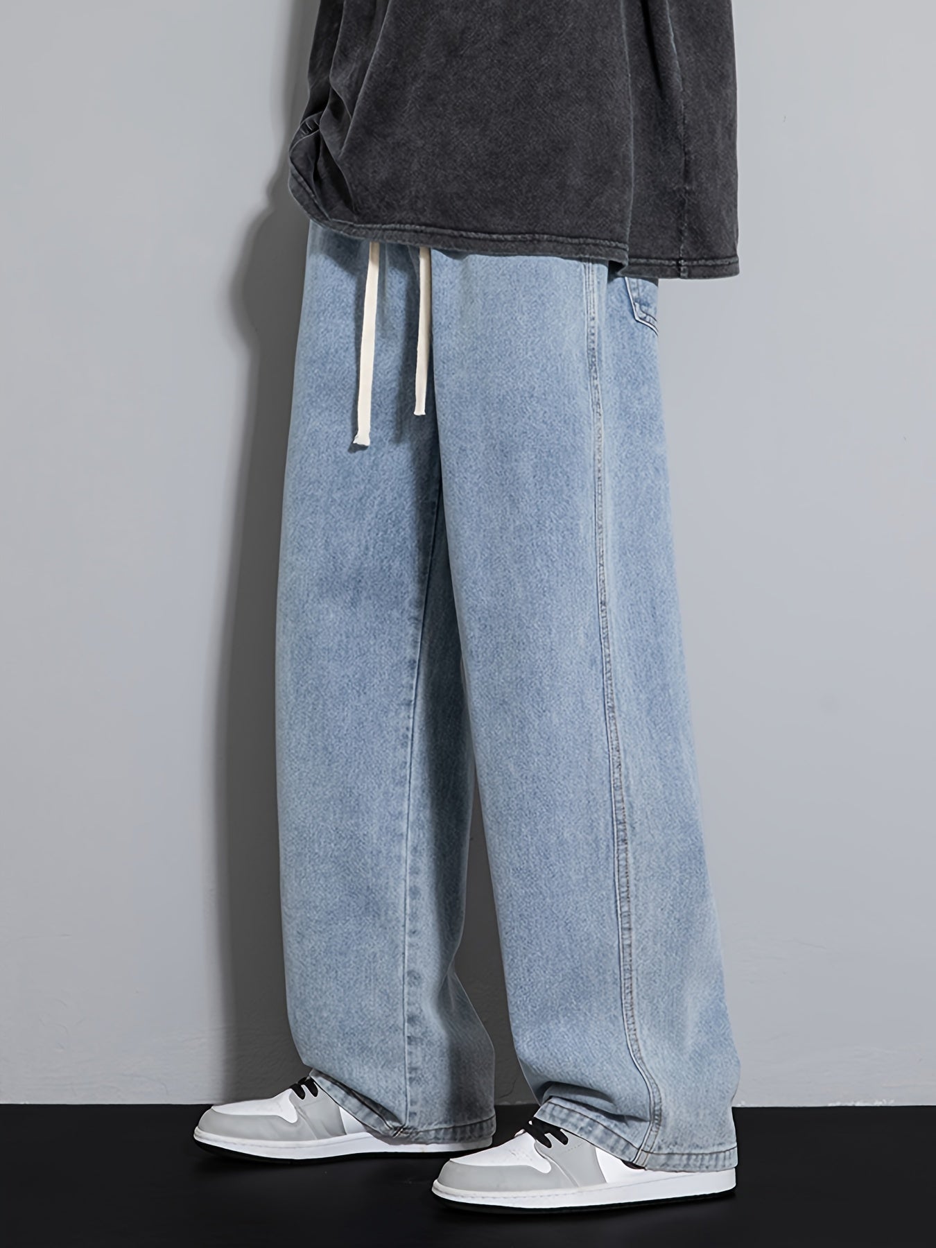 Men's wide leg denim jeans with drawstring waist, loose fit for hip-hop style.