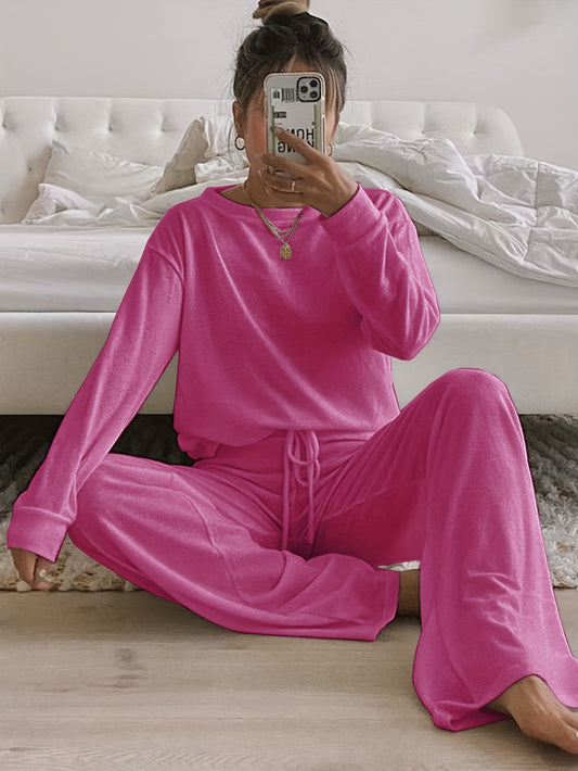 Cozy women's loungewear set in brushed fabric, solid color, round neck, long pants suit made of polyester for adults in autumn/winter season.