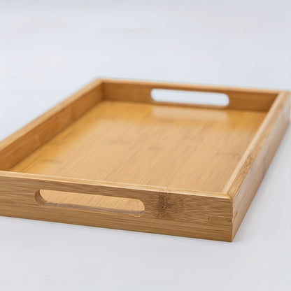 Bamboo serving tray with handles for eating, working, and storing in various locations.