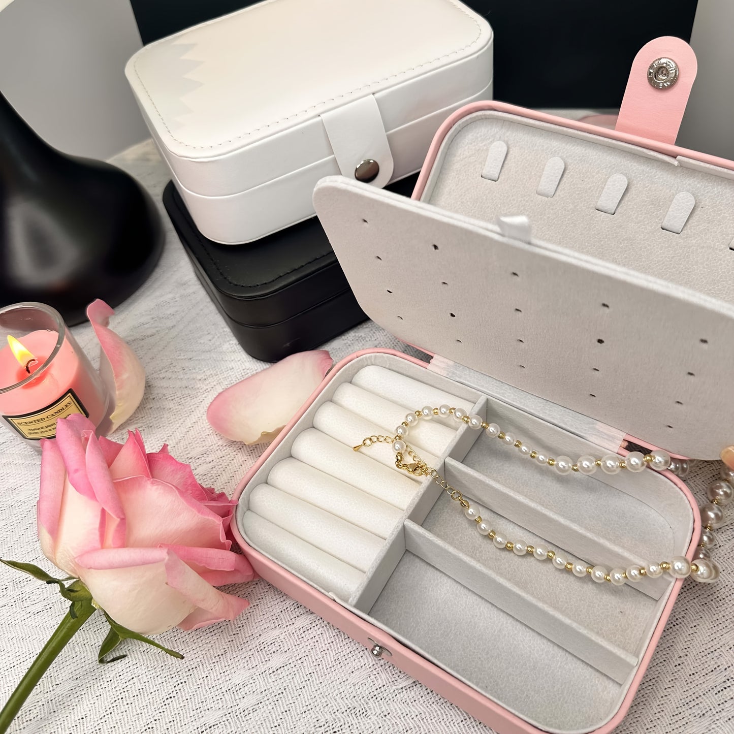 Glam style faux leather jewelry organizer box with double layer, soft lining, secure zipper closure, and textured finish. Tabletop display case for earrings, necklaces, and rings. Multipurpose desktop accessory for organization.