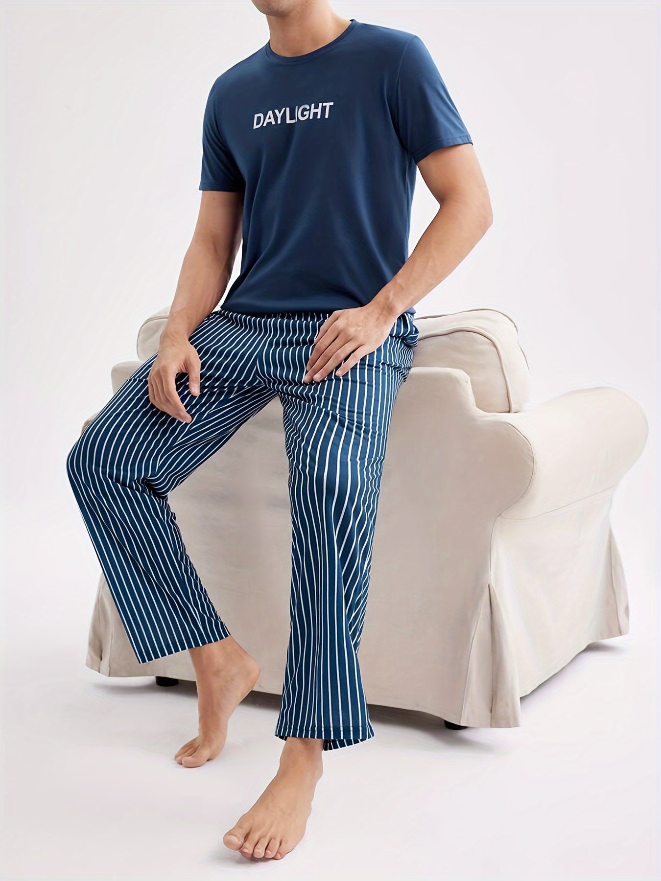 Men's Casual Crew Neck Short Sleeve Pajama Set with Striped Pants, made of 100% Polyester Knit Fabric, with Slight Stretch for All Season Comfort.