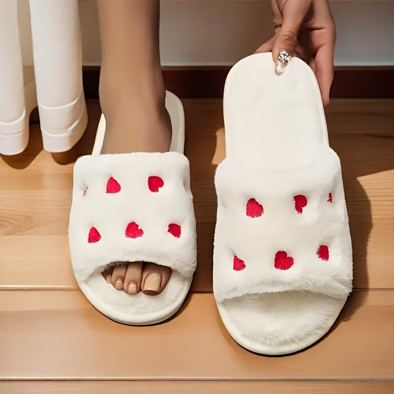 Heart-shaped plush slippers with soft soles, perfect for Valentine's Day in the bedroom.