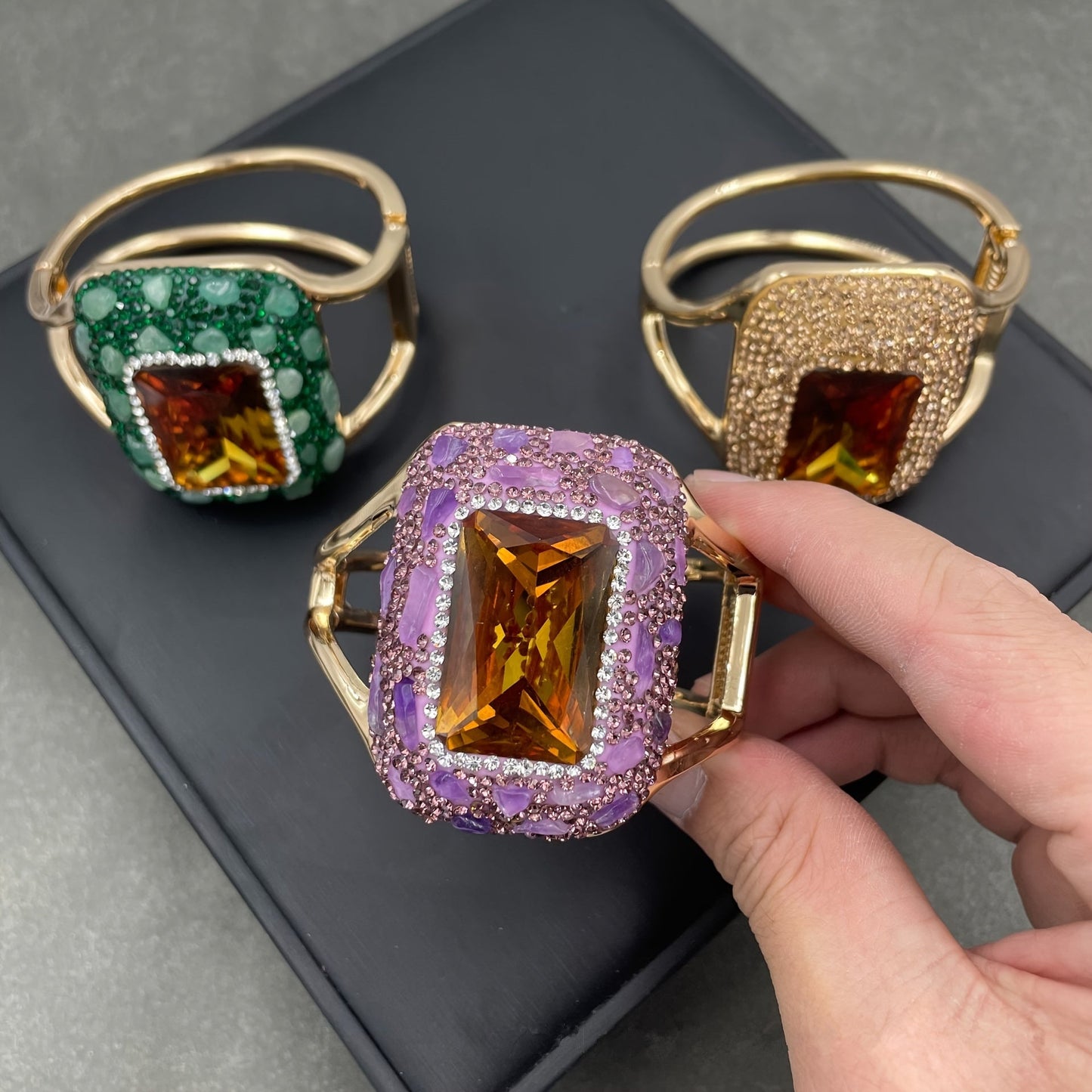 Add some sparkle to your outfit with this stunning Glitter Style Women's Cuff Bracelet! Featuring Rhinestone Accents and a Copper Base, its Large Open Design is sure to make a statement at parties and banquets. Get ready to shine with this Blingbling