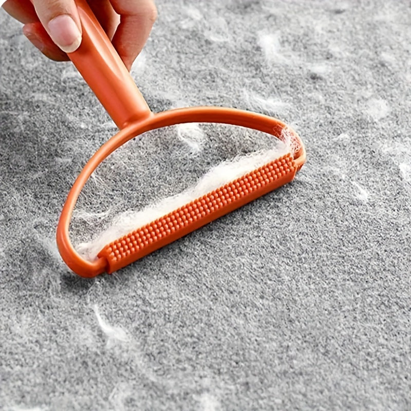 Double-sided manual hair remover made of plastic, ideal for clothes and sweaters, for home and travel use.