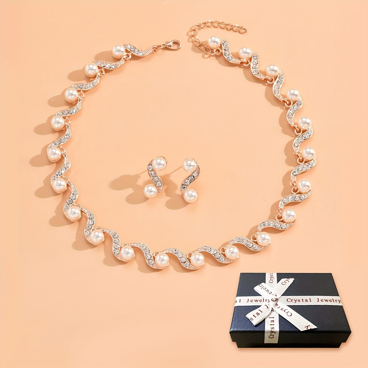 Stunning imitation pearl and diamond jewelry set, ideal for brides to wear on their special day.