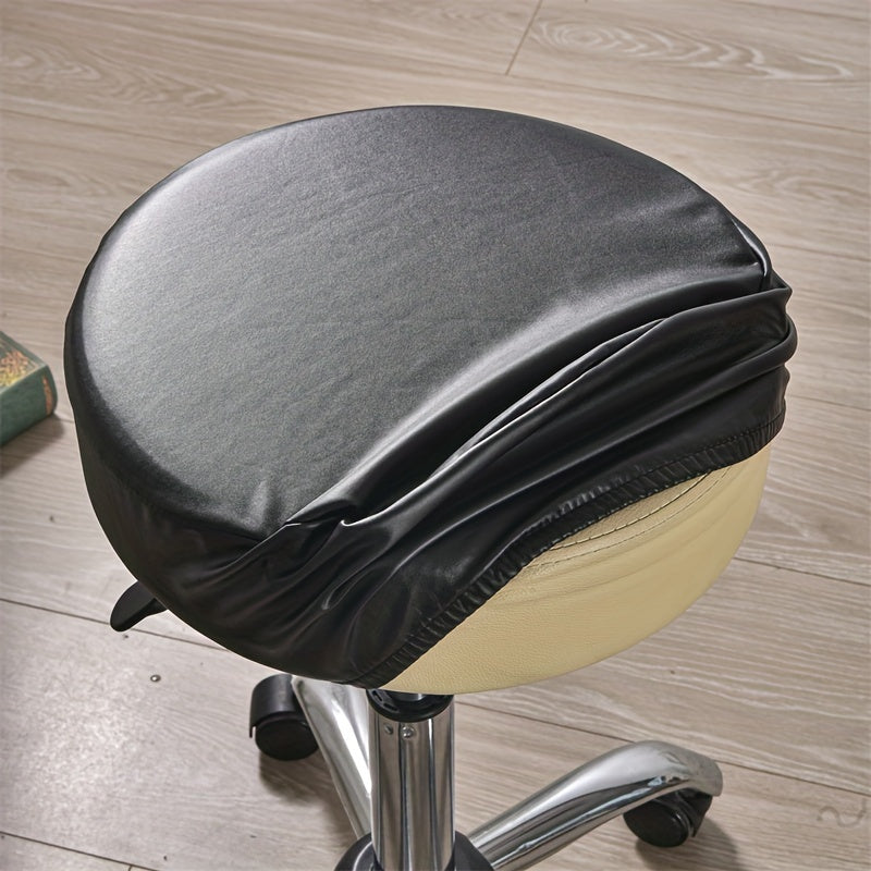 Waterproof faux leather stool cover in black, red, and brown. Elastic fit for various settings. Machine washable.