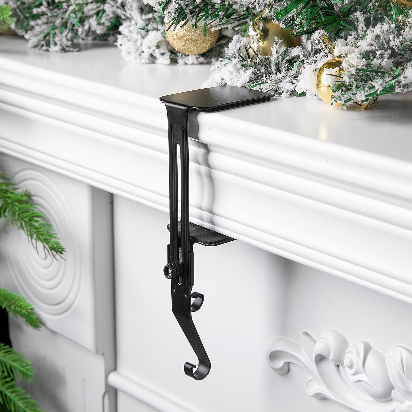 Set of two adjustable metal stocking holders with non-slip pads for securing stockings on fireplace mantel - Perfect for hanging garland and decorations for holiday parties at home.