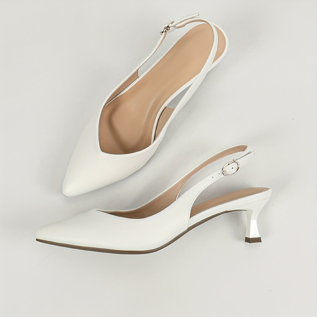 Stylish women's slingback shoes with pointed toe, mid-heel, solid color, and faux leather cover on rubber sole.