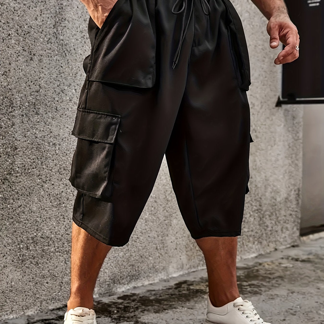 Men's plus size cargo pants with drawstring and pockets, loose fit, and comfortable breathability.