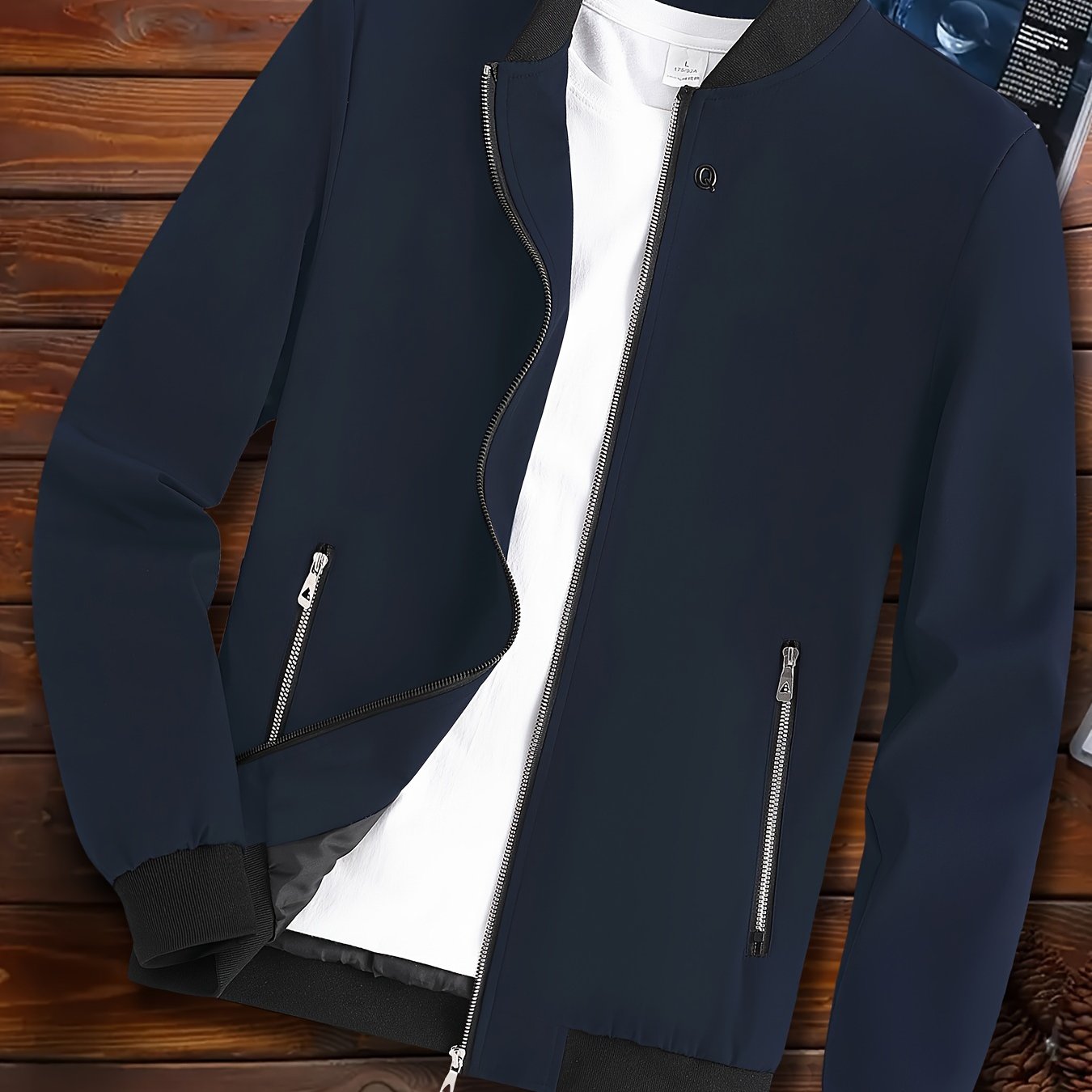 Casual men's windproof jacket with pockets for spring and fall, featuring a lightweight design and stand collar.