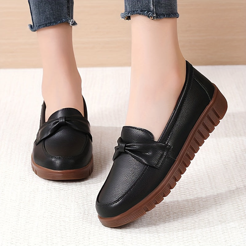 Women's comfortable penny loafers with bow embellishment, non-slip sole, round toe, all-season footwear, man-made materials, TPR sole.