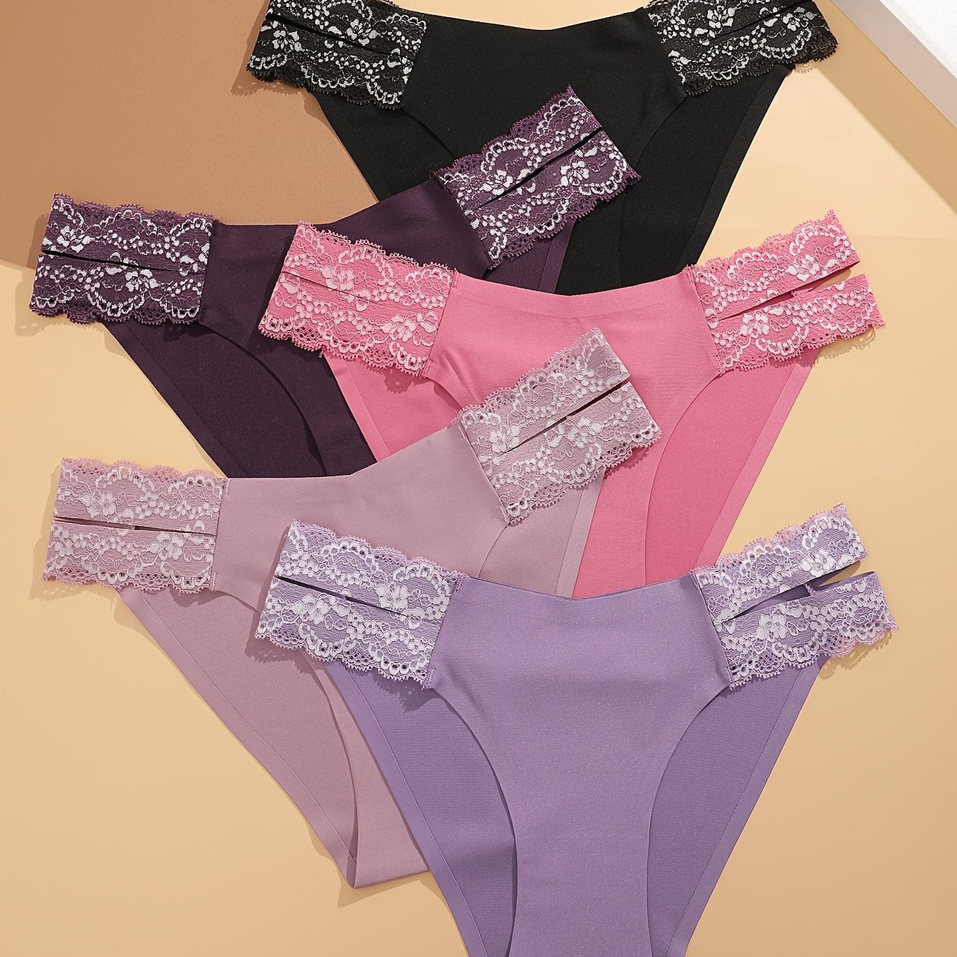 5-pack of low-rise briefs with lace detail, made of polyester, polyamide, and elastane blend knit fabric in solid color, weighing 169 gsm