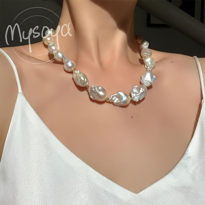 This elegant and unique baroque freshwater pearl necklace from MYSOYA Brand is the perfect accessory for any occasion. With pearls ranging from 14-23mm in size, this handmade boho necklace is a stunning choice for a party, wedding, anniversary, or as a