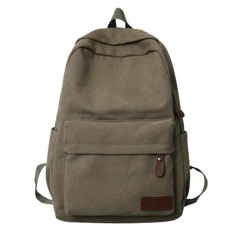 Sturdy canvas backpack with adjustable straps, perfect for school, travel, and work, fits 15-inch laptop.