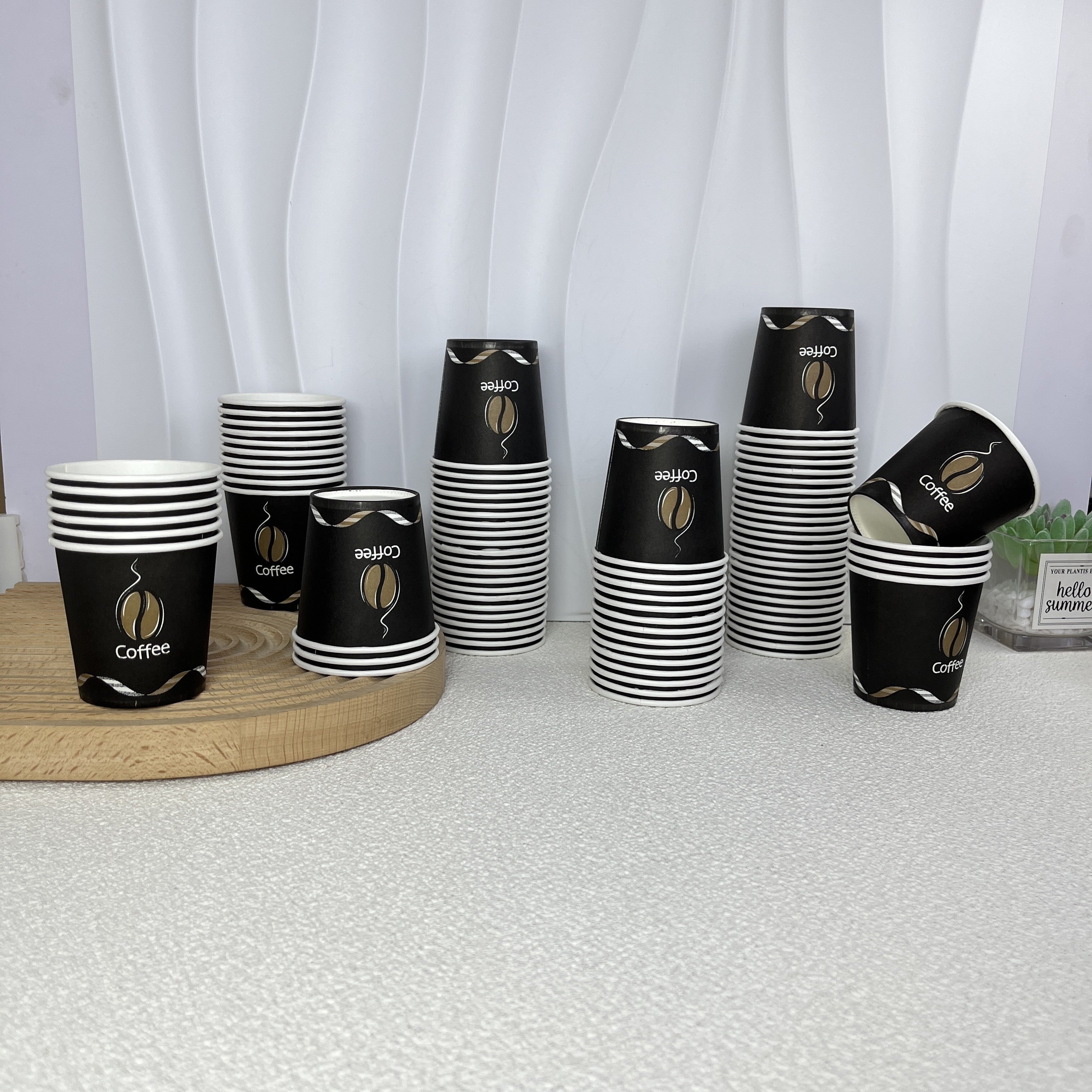 Pack of 50 disposable paper cups coated with poly, each holding 4oz. Versatile cups suitable for espresso, mouthwash, and snack tastings at home, office, or gatherings. Made of food-grade material and recommended for hand washing. Package includes 200