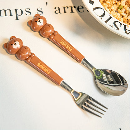 A set of 2 stainless steel utensils with cartoon design, stored in a reusable transparent case, perfect for home, school, or outdoor activities.