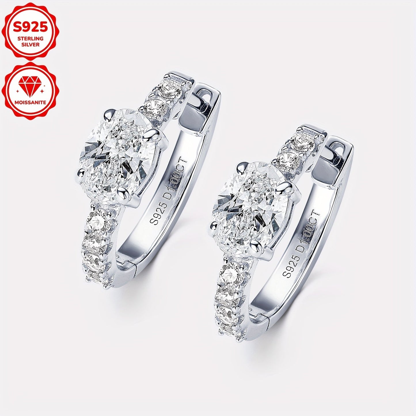 These stunning earrings feature a pair of Moissanite stones set in 925 pure silver. The oval-shaped Moissanite stones measure 5x7mm each, with a total weight of 3.18g. The main stones are Moissanite ovals measuring 5x7mm each, totaling 1ct+1ct=2ct per