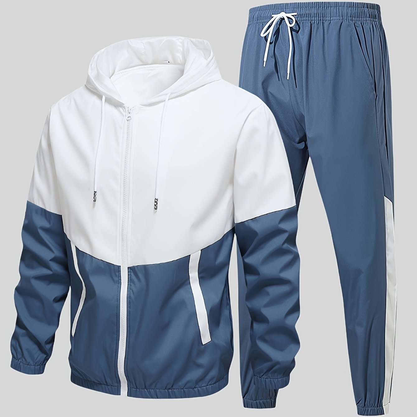 Casual men's sports suit with hooded jacket and pants, featuring a trendy color block design. Made of polyester with slight stretch, drawstring detail, and regular fit.