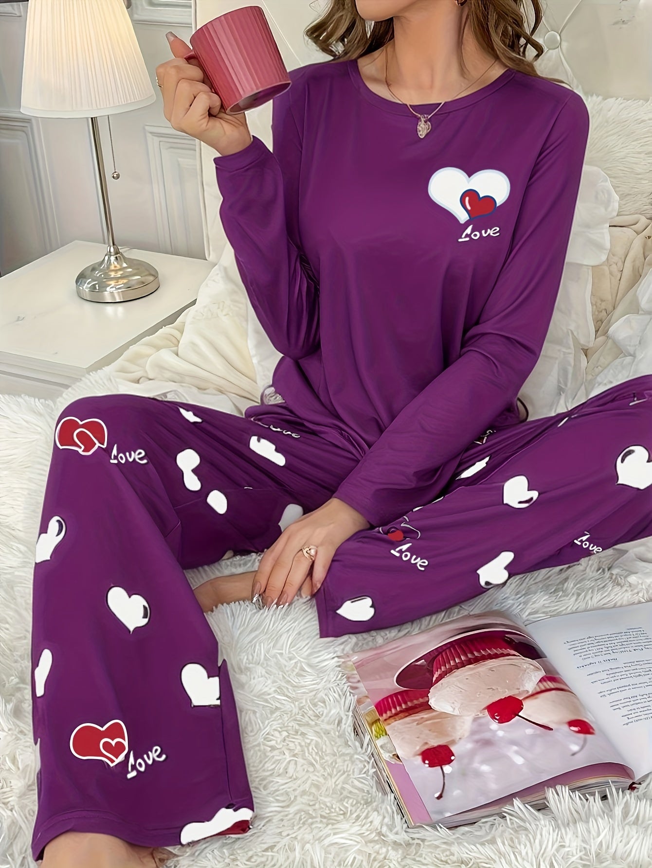 Women's heart print 2-piece pajama set includes long sleeve crew neck top and elastic waist pants in cozy polyester blend for fall/winter.