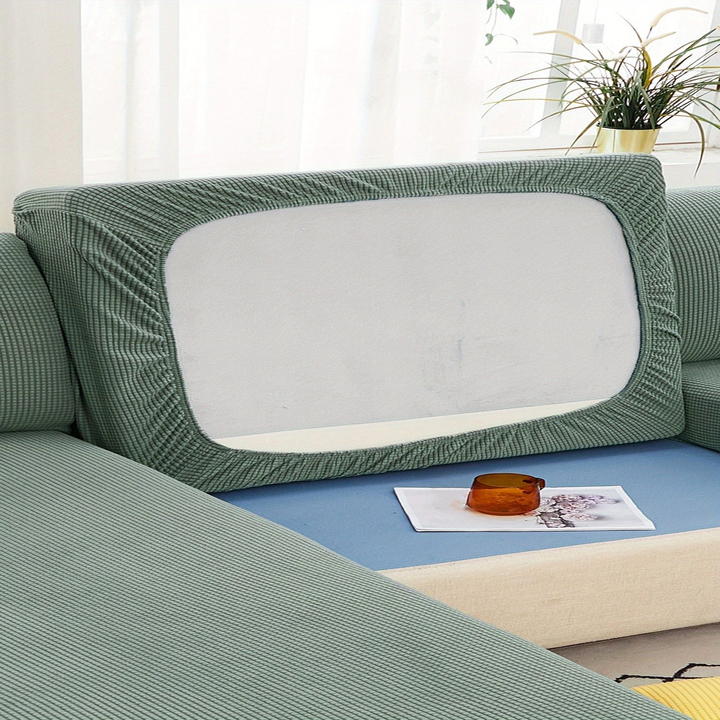 Durable sofa cover protects furniture from spills and stains.