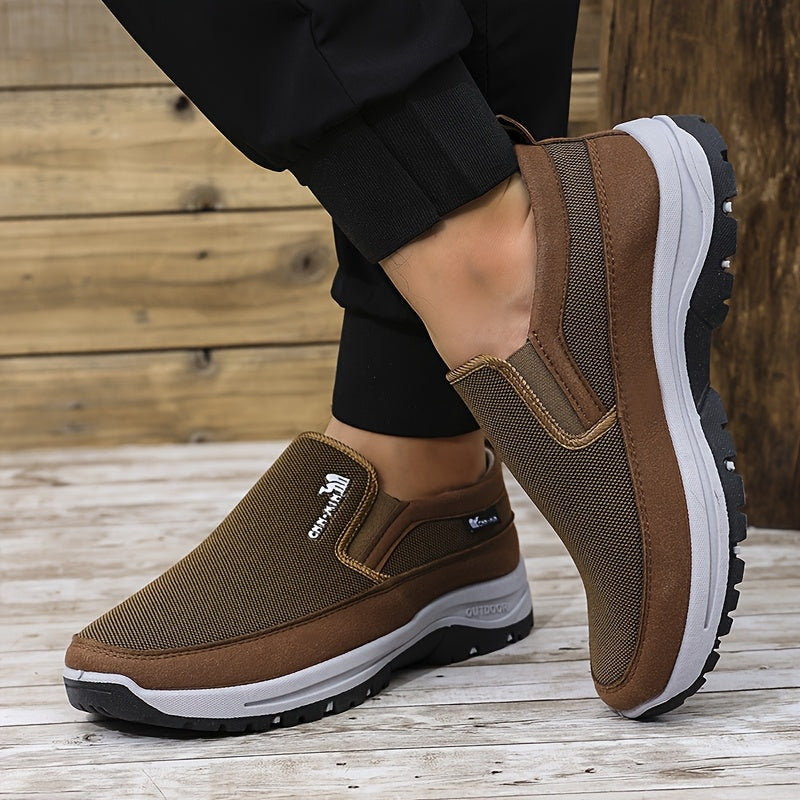 Men's slip-on sports sneakers with breathable fabric upper, round toe, and faux sole for daily wear and running.