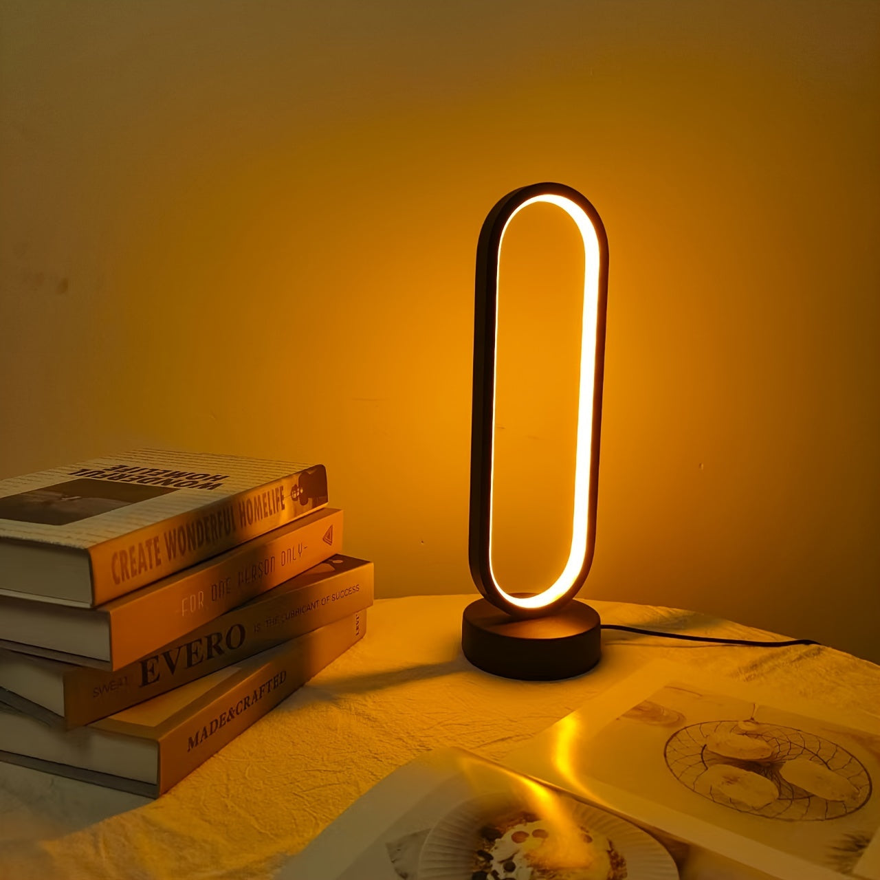 USB-powered LED ring table lamp in black or white; dimmable for bedroom and living room decor.