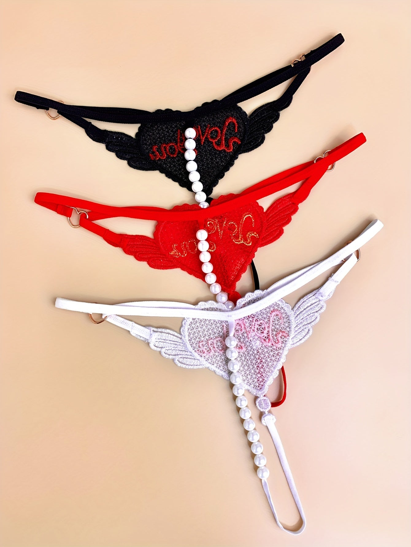 3 Elegant heart chain thongs with 'LOVE YOU' embroidery, perfect for Valentine's Day. Made from soft polyester and spandex blend.