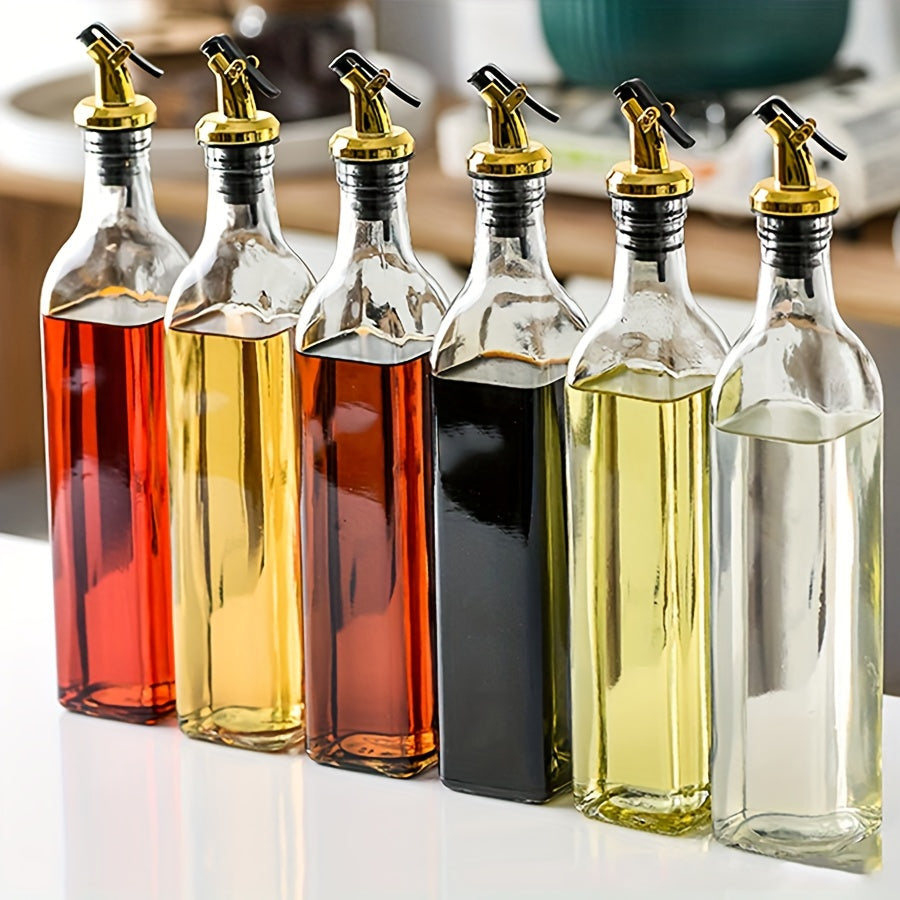 Set of glass dispenser bottles for olive oil and vinegar with a golden pour spout. Hand wash only, PVC free. Includes 6 rectangular cruets with a storage holder rack.