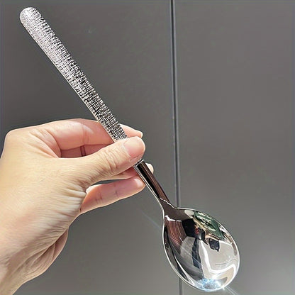 Durable stainless steel spoon with hammered round head design - ideal for kitchen and restaurant use. Easy to clean with a mirror polished finish. Suitable for soups, rice, and desserts.