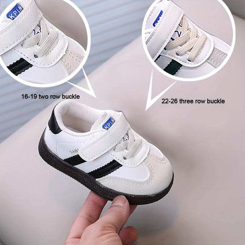 Minimalist unisex toddler sneakers with solid color, adjustable strap closure, slip-resistant sole, and breathable fabric.