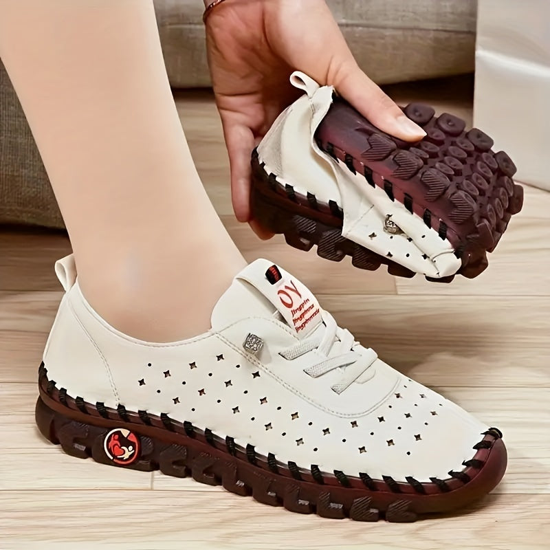 Flat lace-up shoes for women with hollow out design, breathable material, and solid color sneakers for walking.