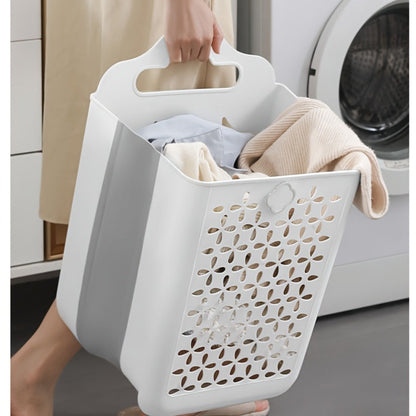 Contemporary wall-mounted laundry basket made of durable plastic with handles. Measures 39x27x19cm and is foldable for easy storage. Can be used as a bathroom organizer or multipurpose hollow bucket for toys, snacks, fruits, and vegetables. Features a