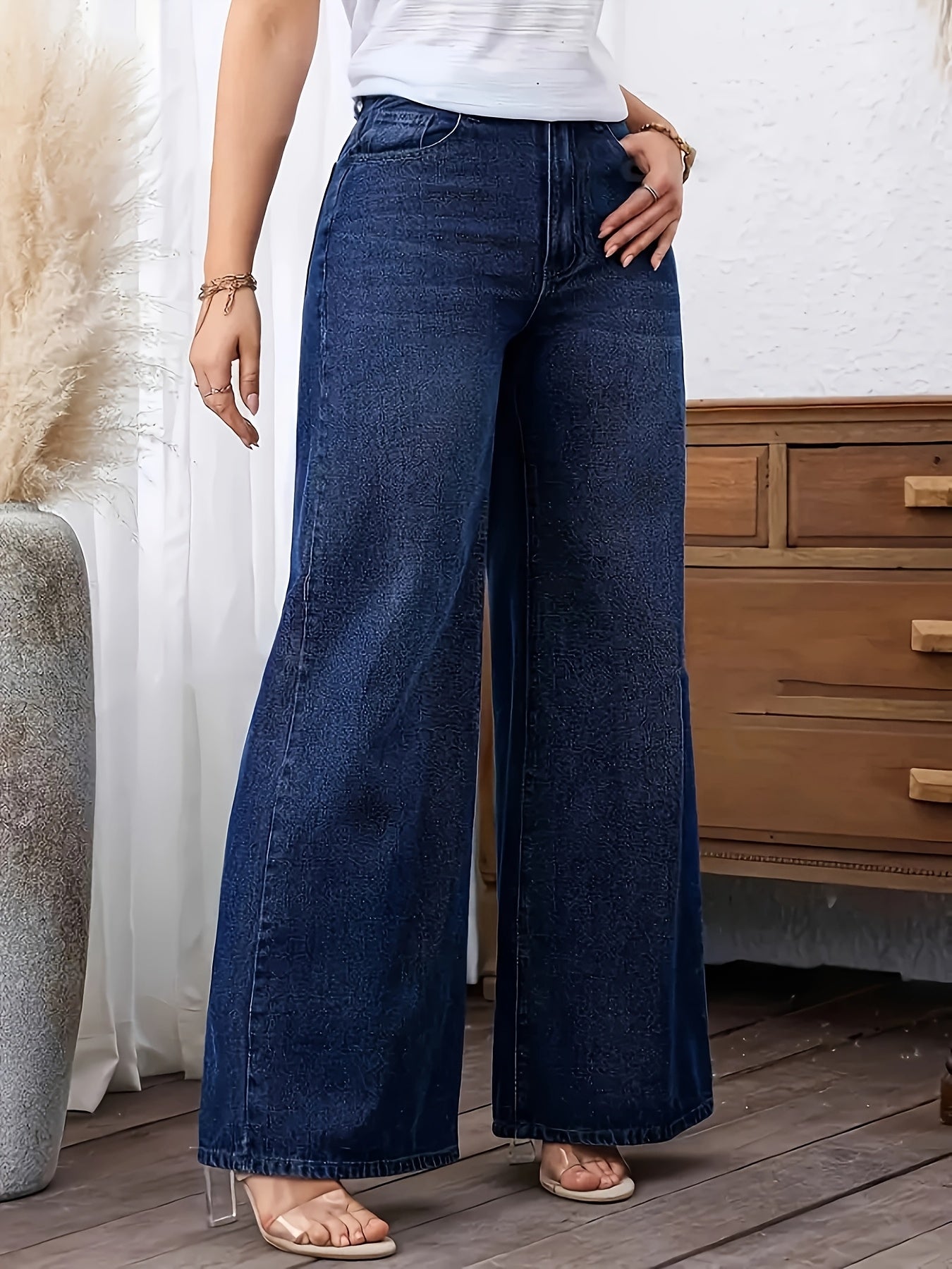 Women's plus size denim jeans with straight leg, solid color, medium stretch, washed fabric, and wide-leg design suitable for all seasons.