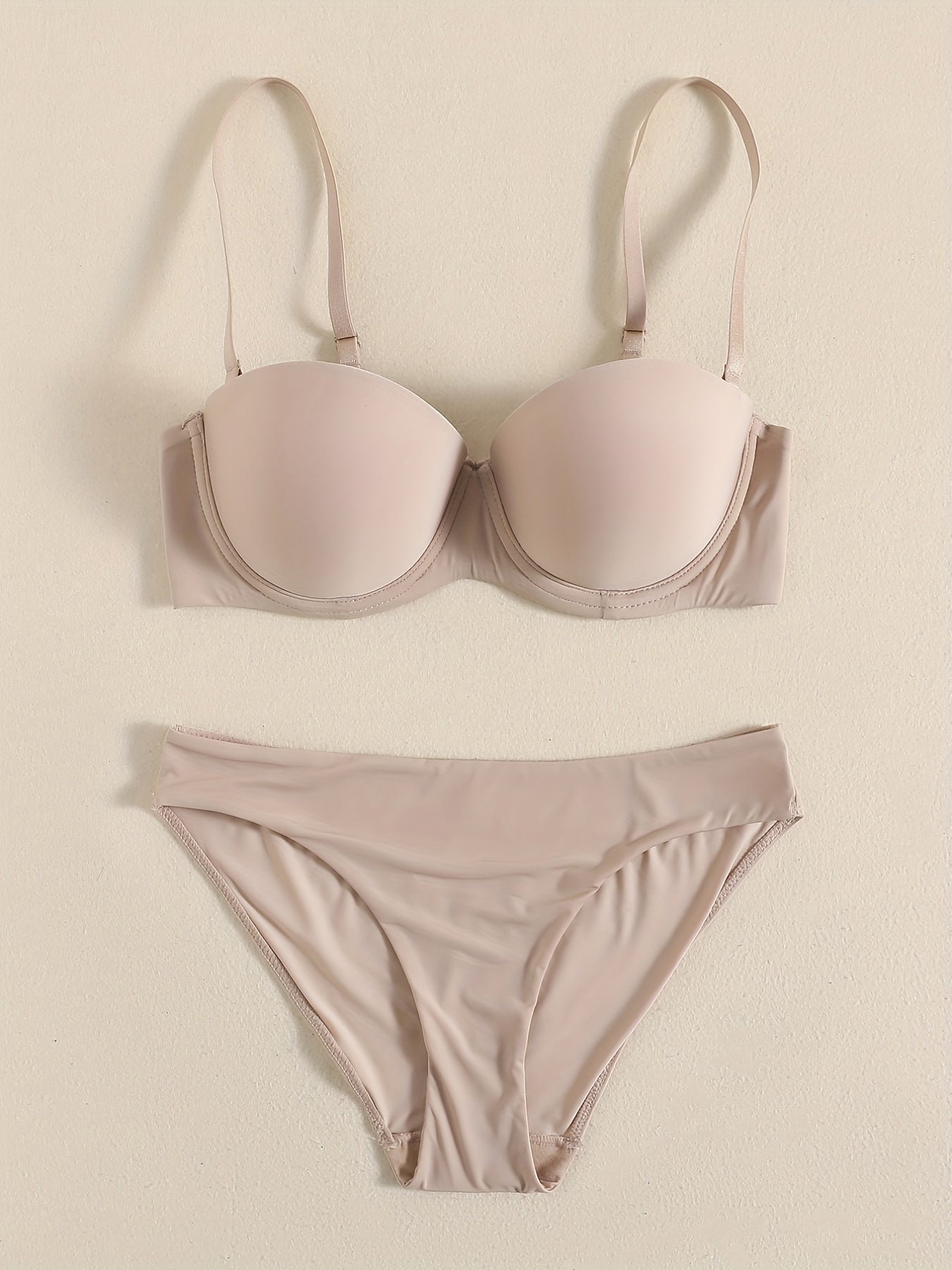 Smooth lingerie set including seamless bra, balconette bra, and bikini panties for women.