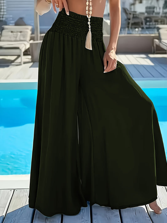 Plus size women's high-waisted wide leg pants in solid green polyester with tassel detail, perfect for comfortable casual outings.