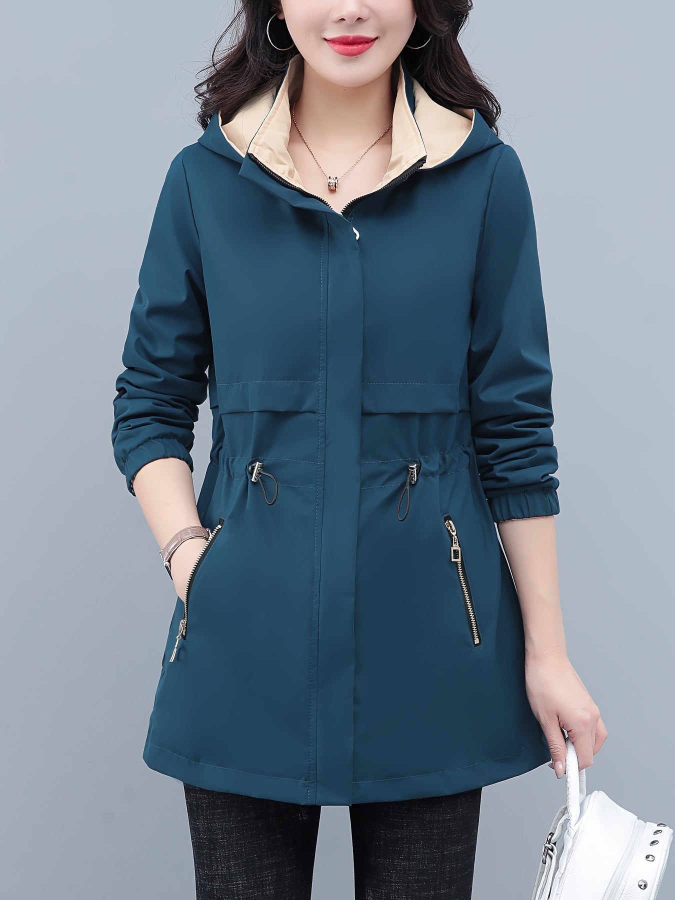 Spring and fall jacket for women: Long sleeve windbreaker with drawstring waist and zip-up hoodie.