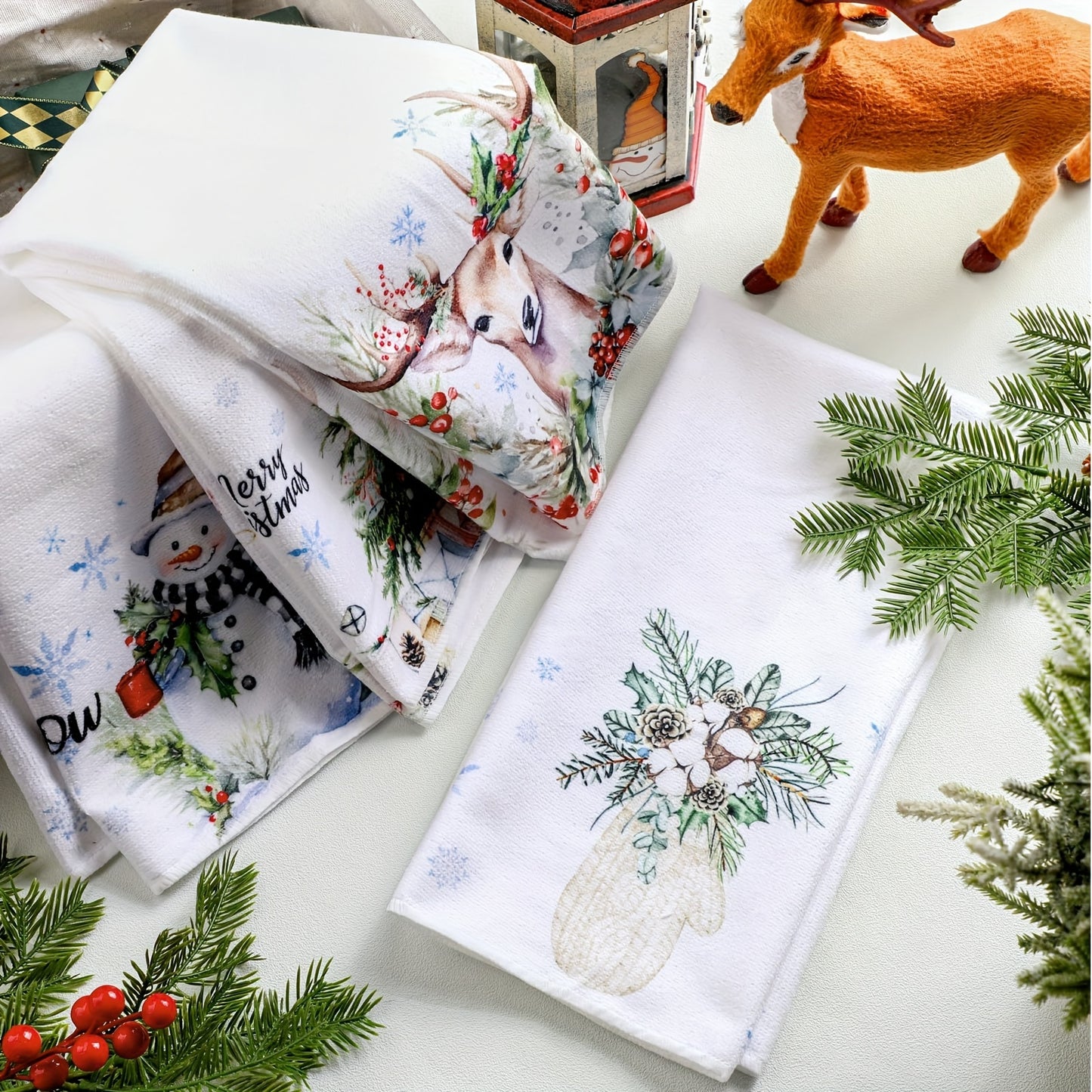 2-piece Christmas kitchen towel set with absorbent design featuring Christmas tree, snowflake, snowman, and winter watercolor reindeer. Perfect for housewarming bathroom supplies.