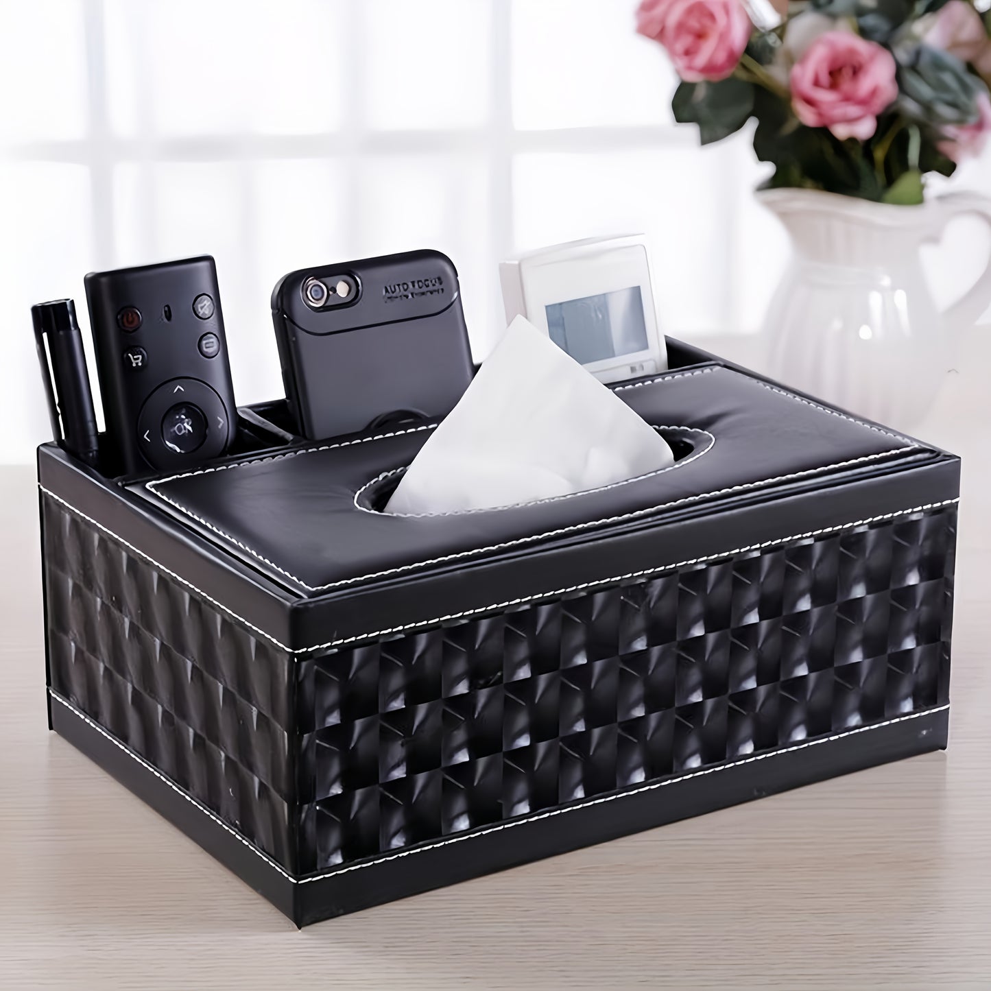 Versatile faux leather tissue and storage box with four compartments, ideal for coffee table and living room. Includes remote control holder and napkin organizer, perfect for home