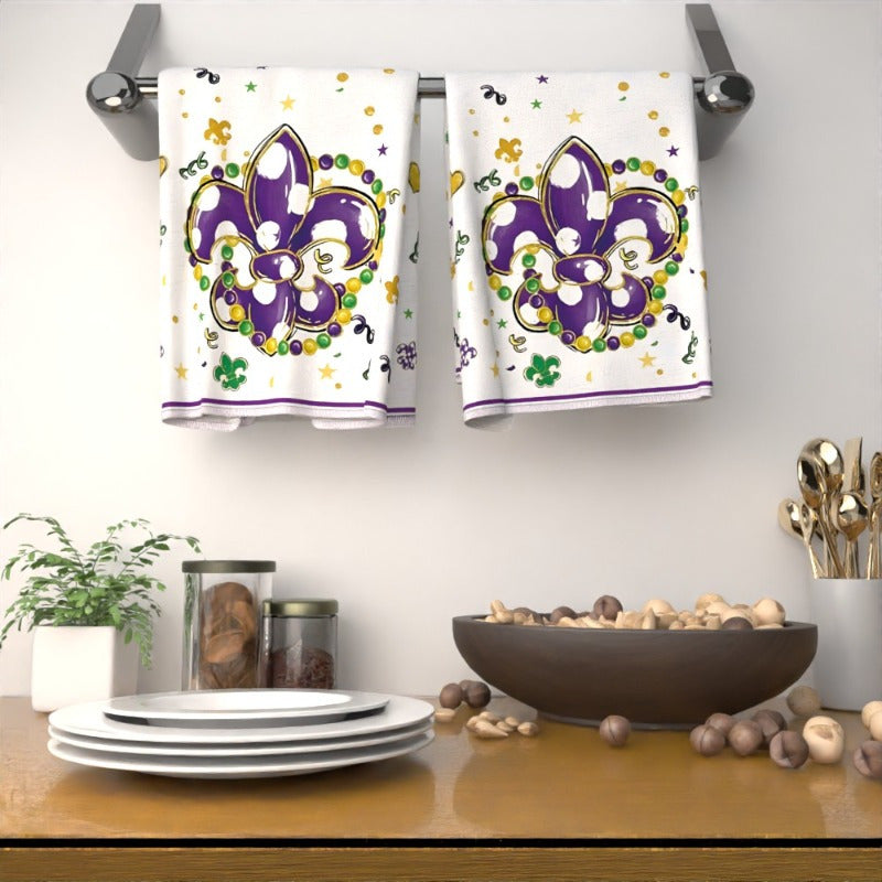 Two pieces of 45.72*66.04 cm Mardi Gras Fleur-de-lis kitchen towels featuring a colorful carnival floral design. These decorative dish towels are perfect for home, party, and festive celebrations. They make a unique gift idea for Mardi Gras enthusiasts